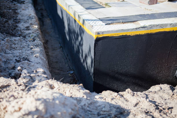 Professional Waterproofing technician working in Johnson Creek, WI